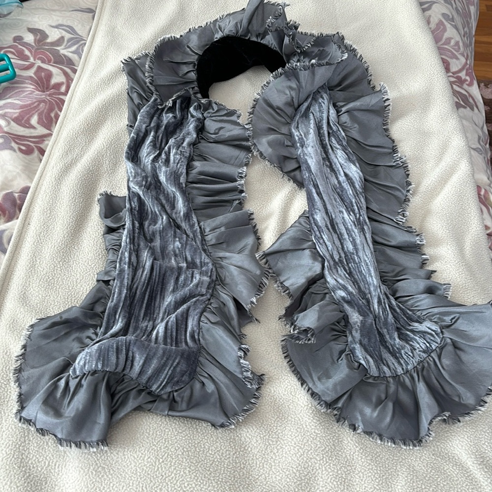 Silver scarf, black velvet backing.